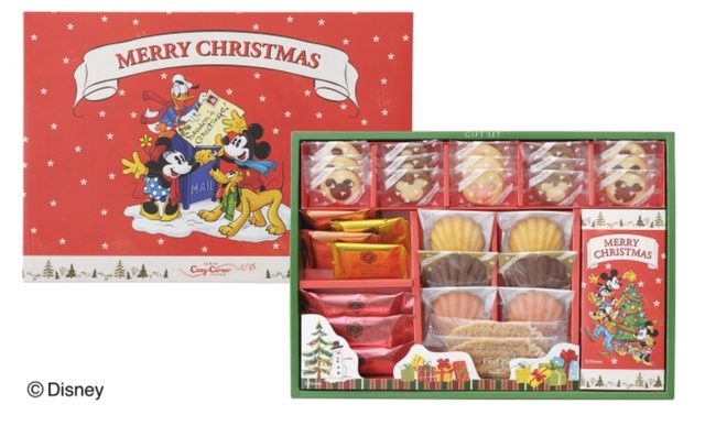 画像: 【商品概要】(※販売期間:2015年10月1日~12月末頃) 商品名:「ディズニー クリスマスギフト(12種38個入)」 価 格: ¥2,500(税込¥2,700) 内 容: マドレーヌ(プレーン・ショコラ・いちご)、リーフパイ、 焼きショコラ(ミルクアーモンド・ホワイトマンゴー) … 各2個 かぐわし焙煎ブラウニー … 3個 クッキー … 3種計15個 クリスマスツリーチョコ(メロン&スイート・スイート&ミルク) … 各4個 特 長: マドレーヌやミッキーシルエット柄のクッキー、クリスマスツリーチョコなどを、ディズニー・デザインのかわいいパッケージに詰め合わせました。ディズニー・ファンやお子さまにおすすめのクリスマスギフトです。