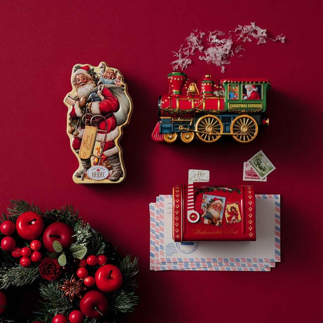 画像: 「クリスマスモチーフのかわいい缶は、渡したときに会話が広がります」（海老名ららぽーと 大塚さん） 例：チョコレート缶（サンタクロース 税込1,782円、機関車 税込1,890円、メールボックス 税込1,836円）