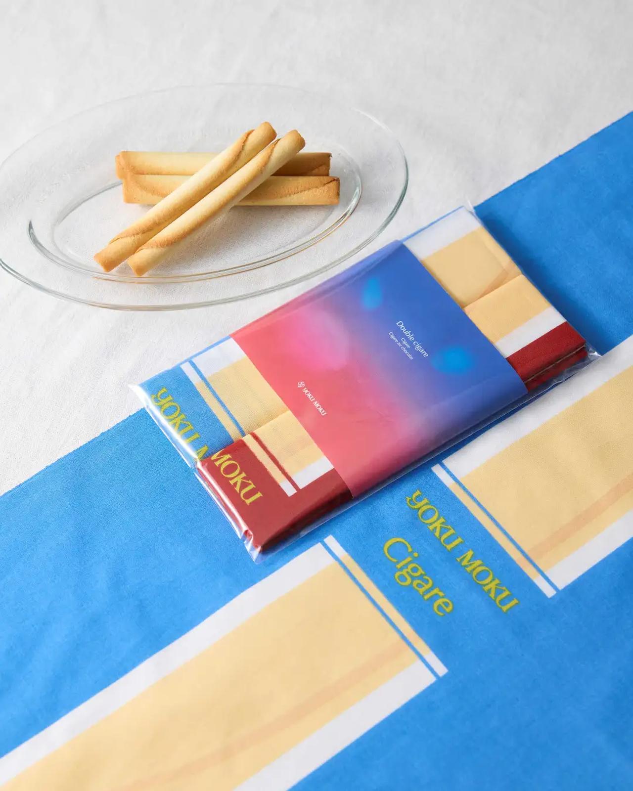 画像: イベント会場および対象店舗にて「ドゥーブル シガール」を含む、合計金額5,400円（税込）以上お買い上げいただいた方に「シガール®」や「シガール オゥ ショコラ」がデザインされたオリジナル手ぬぐいを各1枚計2枚セットでプレゼントします。