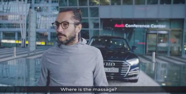 画像: 案内された先にはAudi A8が。「マッサージはどこ??」と訝しがる男性。 youtu.be