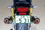 画像: 車体にピタリと沿わせたフォルムは高い製作技術があってこそ。JMCAが認定した政府認証品なので車検対応。オイル交換、オイルフィルター交換もOKで、センタースタンドもそのまま使える。