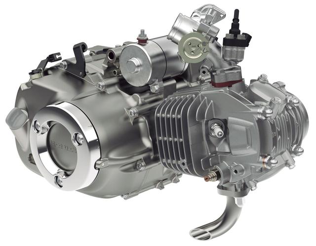画像: エンジンは空冷SOHC2バルブ単気筒(124cc)。ボア・ストロークは52.4×57.9㎜。ステップに乗せた足にエンジンが触れないよう、クランクケースにはメッキのリングガードを配した。