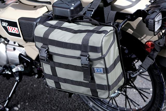 画像: 新たにスタートしたアウトドア系ブランド「K3」ネームで開発中のサイドバッグ。別売りのバッグサポートを装着後、ストラップで取り付ける。汎用で他車種にも使用可能。