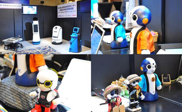 画像: 手前味噌ながら、BITSの展示は年々面白くなっていく。具体的に目に見えて体感できる商材が徐々に増えているからだ。その中でも、やはりロボットは分かりやすい。左上は、日本ユニシスのロボット群。店舗でお客さまのナビゲートを担当したり、夜中にRFIDを読んでひとりでに在庫管理をしたり、災害の現場でドクターと避災者のコミュニケーションを手助けしたり・・・有効で楽しみな応用が増えている。