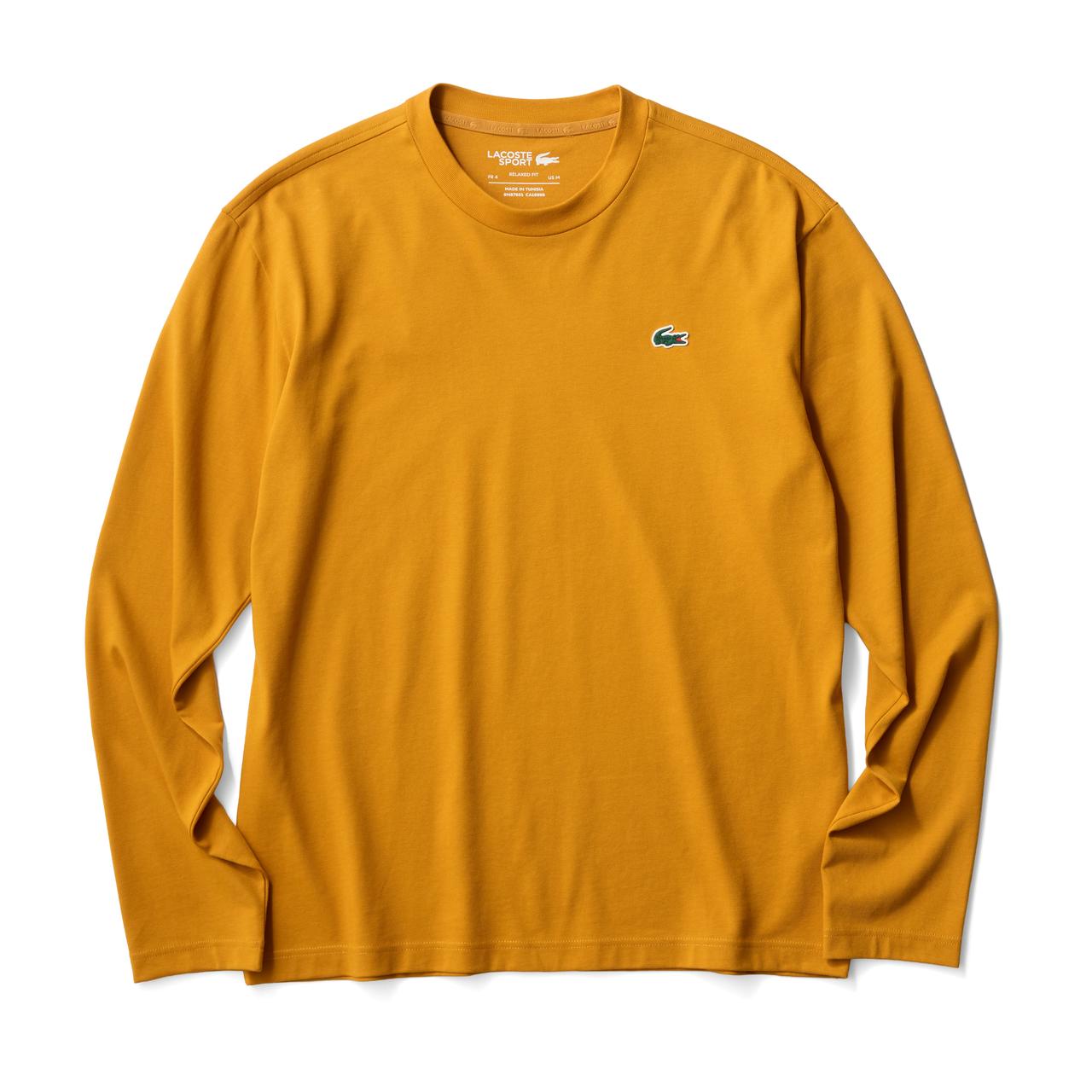 画像: アレンジ自在の優れたドライ素材　トレンド感のあるやや大きめのシルエットのロングスリーブ型。ポップすぎないオレンジは普段使いやゴルフのインナーにも役立つカットソー1万2100円（LACOSTE）