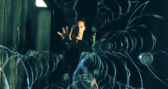 画像: 流れ落ちる緑のコンピュータコード 「マトリックス」(1999)