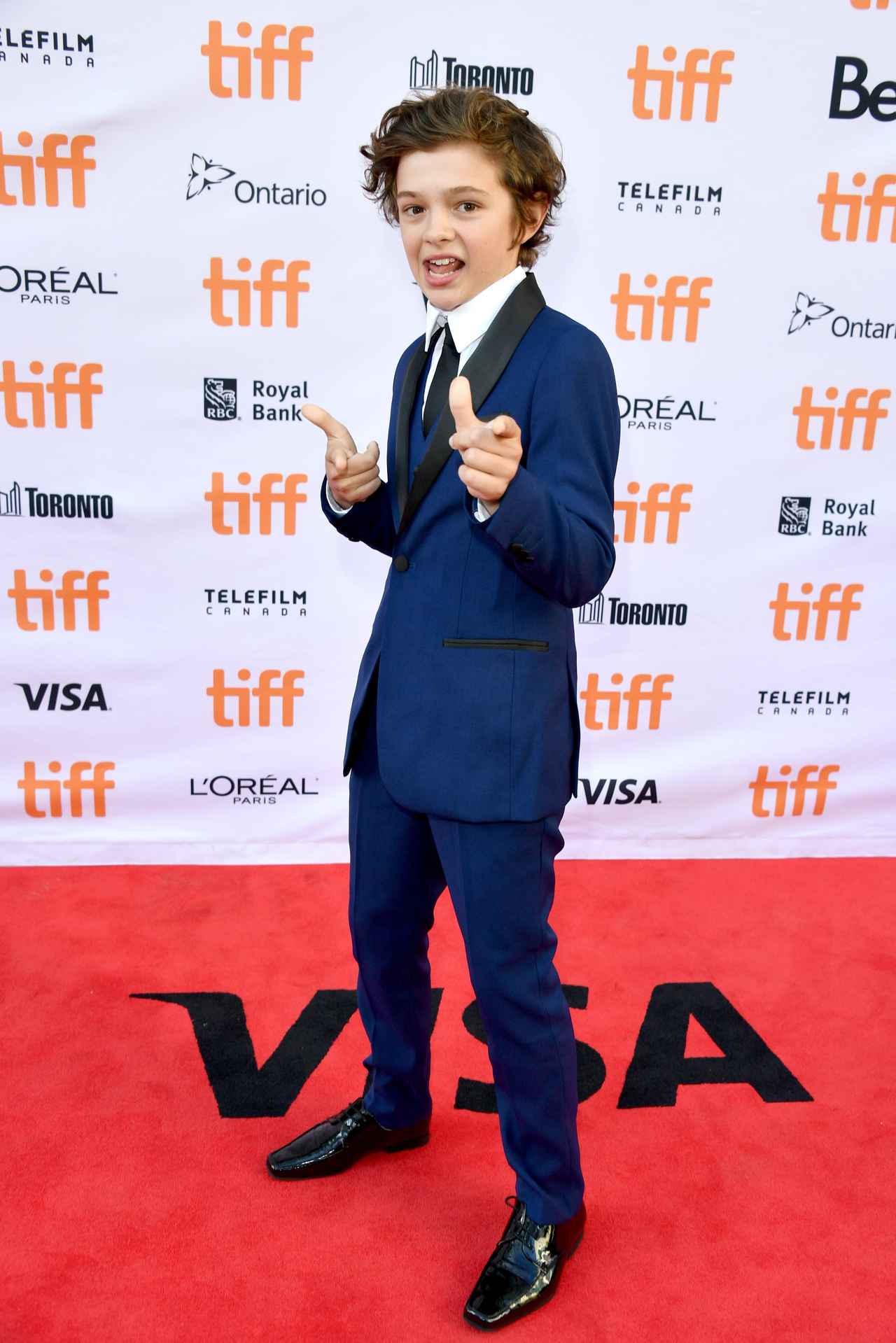 画像: マット・デイモン演じる主人公の息子を演じた『サバービコン 仮面を被った街』（17）のプレミアにて。