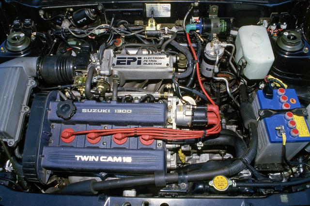 画像: 6500rpmで97psを発生するG13B。1987年10月のマイチェンで110ps/7500rpmまでパワーアップした。