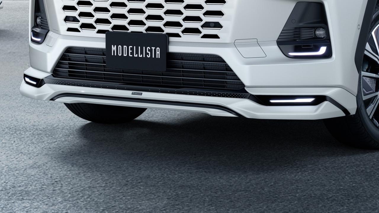 画像: フロントスポイラー：左右に配置したシャープなLEDイルミとセンターから広がる立体的なウイング形状により、スタイリッシュな存在感を演出。