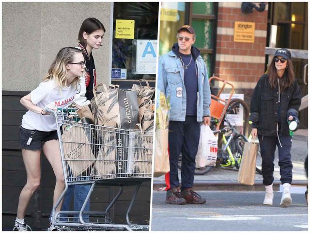 画像: 隔離生活に向けてスーパーに買い出しに出かけたモデルのカーラ・デルヴィーニュ&カイア・ガーバー(左)と、エミリー・ラタコウスキー(右)。