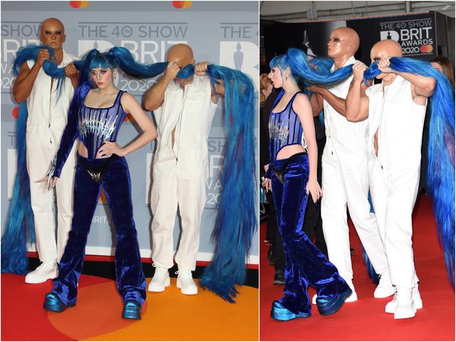画像: BRIT AWARDS 2020では、屈強な男性2人にドレスのトレーンの代わり約3メートルものヘアを持たせてレッドカーペットを歩いた。
