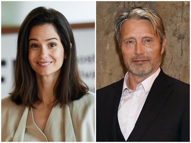 画像: ティナ役のキャサリン・ウォーターストン(左)とグリンデルバルド役のマッツ・ミケルセン(右)。