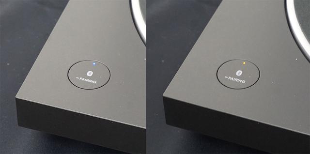 画像: Bluetoothのペアリングは写真のボタンを長押しして行なう。左の青いLEDが接続状態で、右はペアリングができていない状態を表す。ペアリングしておくと、本体でレコードを再生したら自動的にBluetooth接続機器を起動する