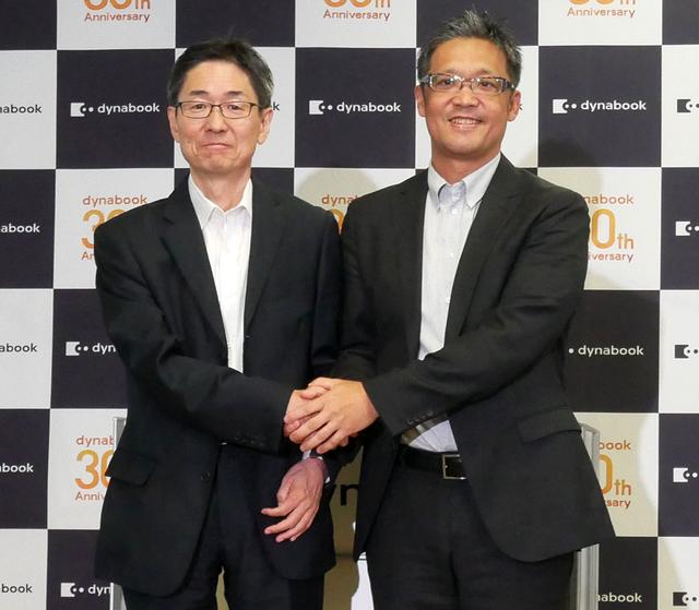 画像: ▲覚道社長(左)と日本マイクロソフトの執行役員 梅田成二氏(右)
