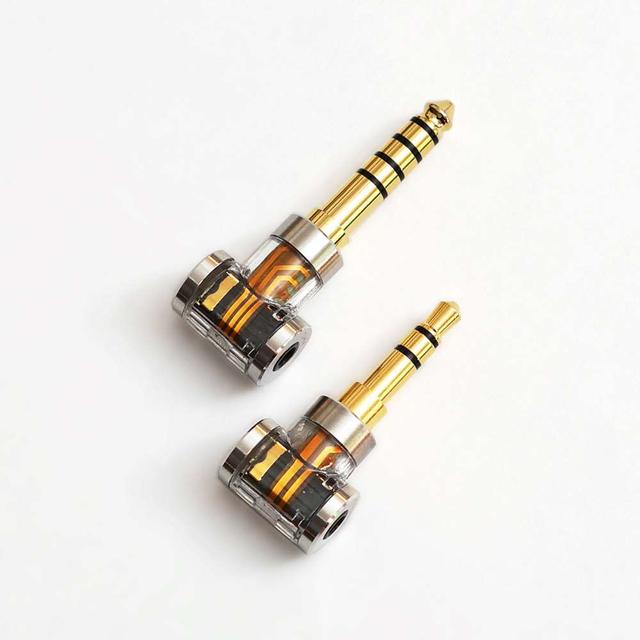 画像: 変換アダプター「DJ44A」(4.4mm)、「DJ35A」(3.5mm)。中身が見えるスケルトン仕様