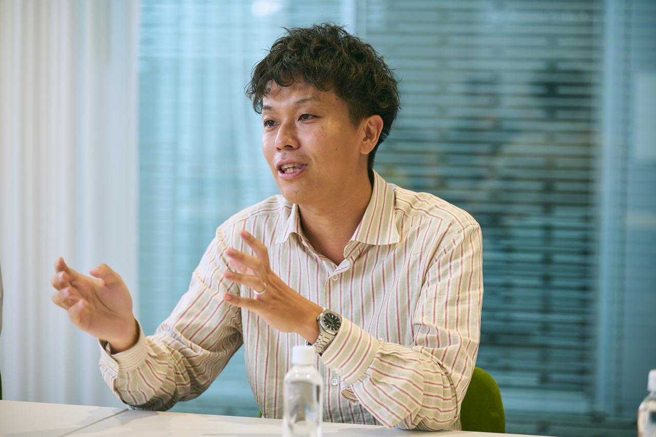 画像: 末吉史弥氏（日立製作所 AI＆ソフトウェアサービスビジネスユニット デジタル事業開発統括本部 Data＆Design Data Studio 主任技師）