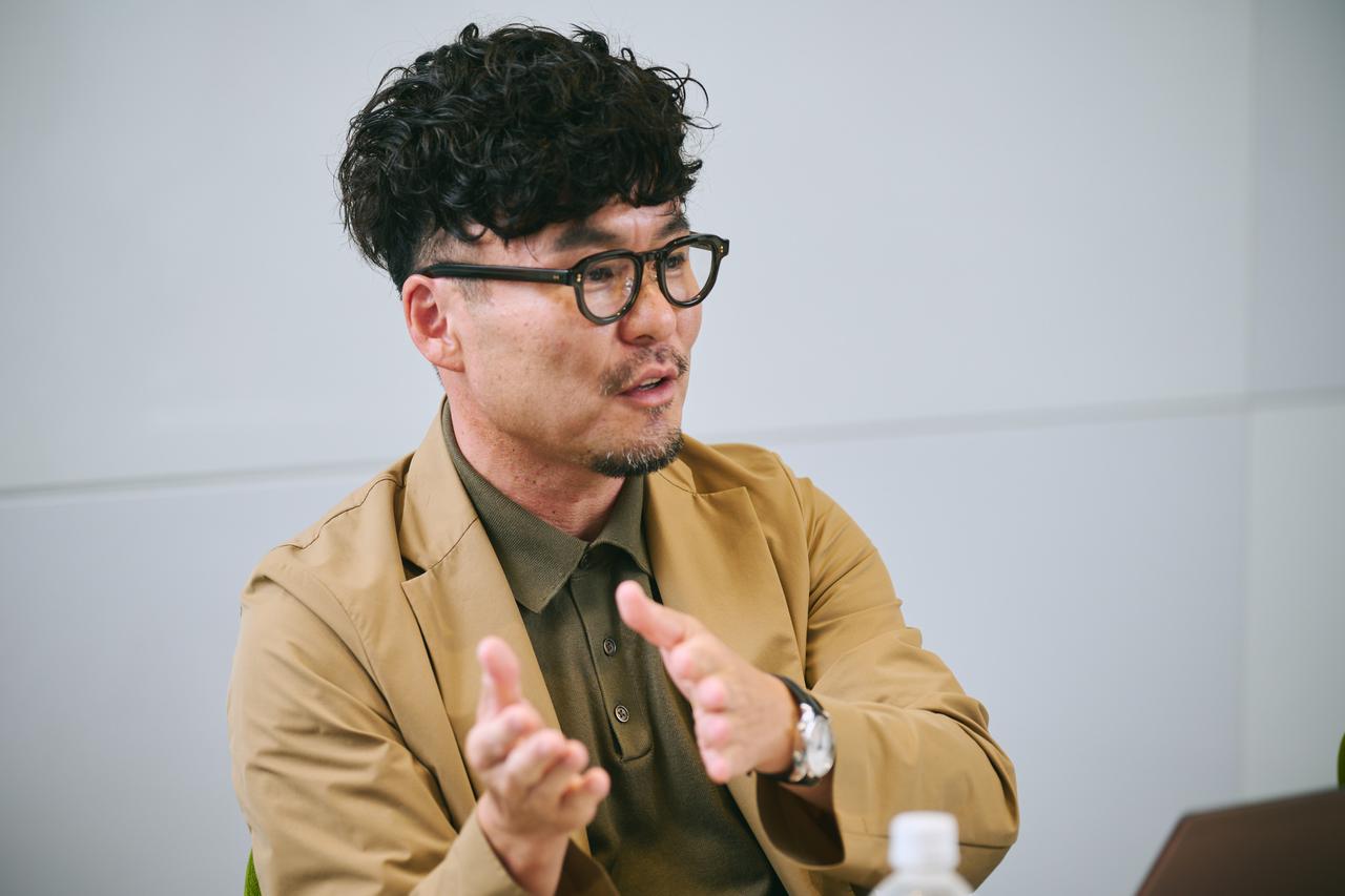 画像: 斎藤岳氏（日立製作所 AI＆ソフトウェアサービスビジネスユニット アプリケーションサービス事業部 LSH適用推進部 部長 兼 AICoE Asset&Scaling AIアセットアクセラレーション部長）