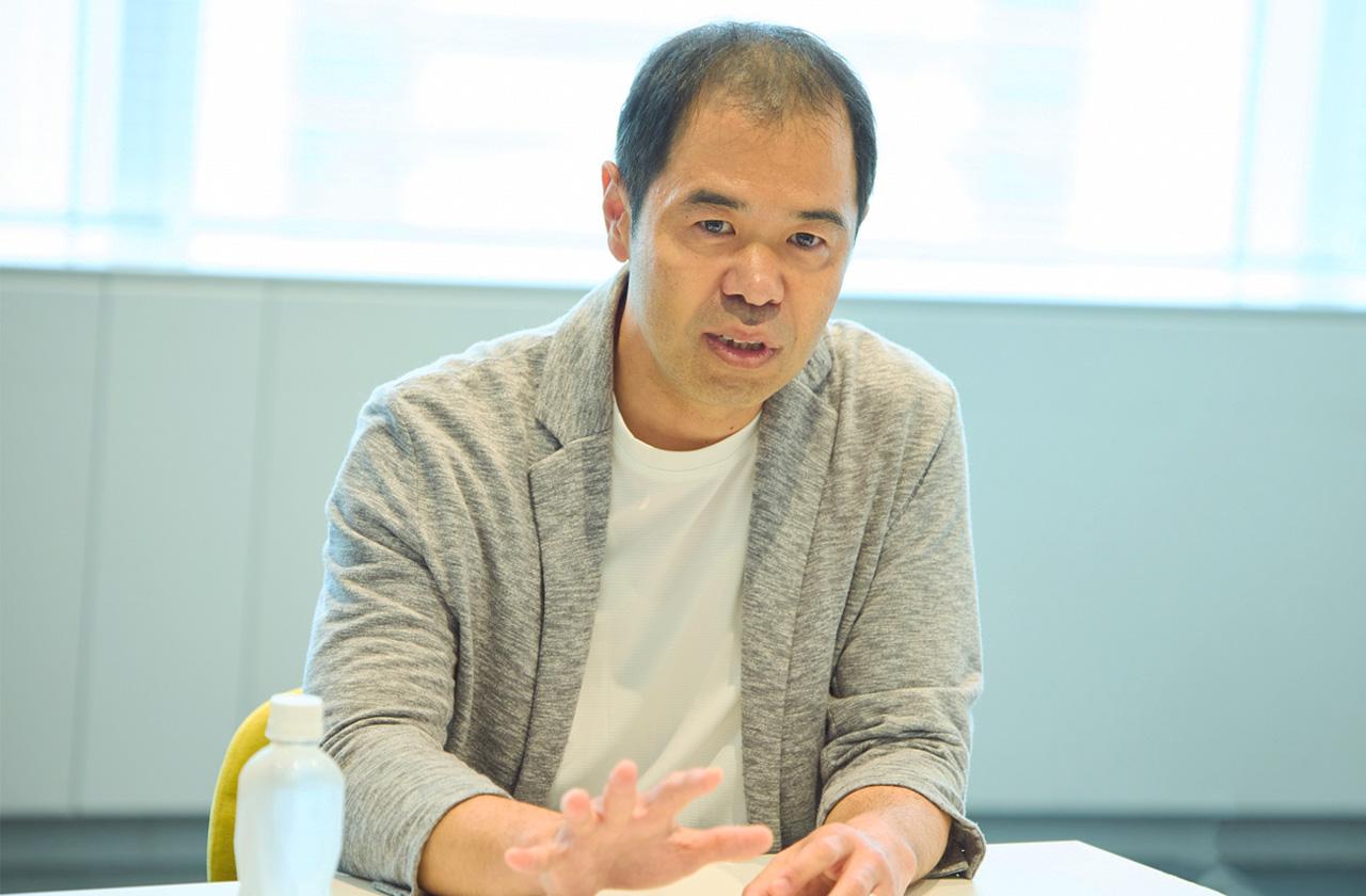 画像: 朝木 克利（あさき かつとし） 株式会社 日立製作所 AI＆ソフトウェアサービスビジネスユニット アプリケーションサービス事業部 HMAX＆AIサービス本部AIサービス推進部　担当部長