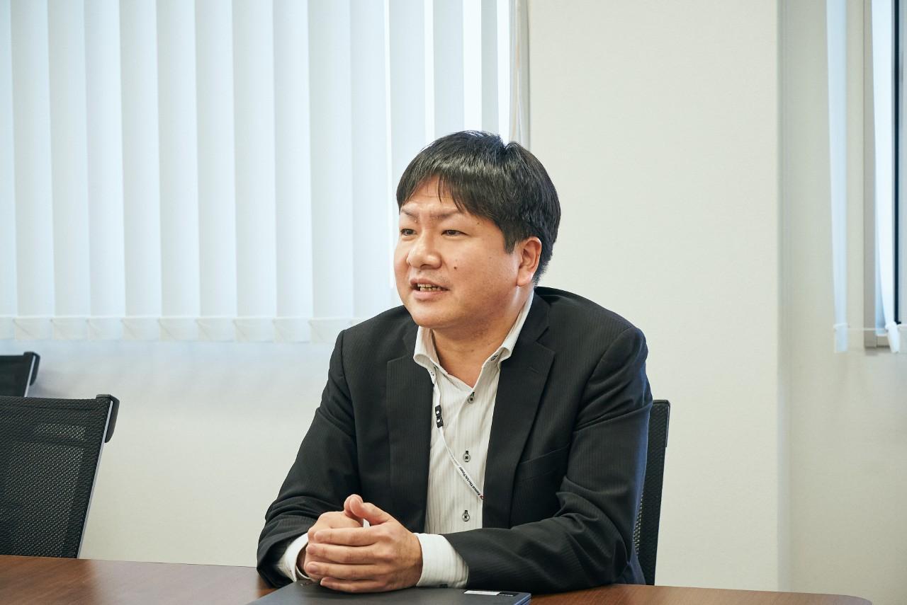 画像: 立地室 立地グループ マネジャー 古賀達朗