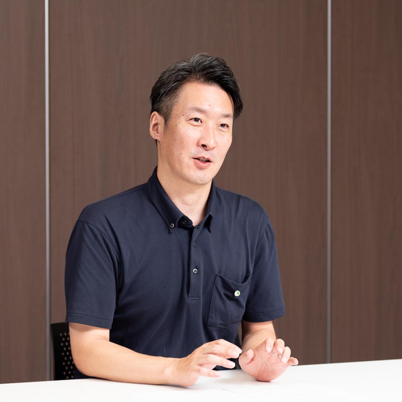 画像: 野村英二氏（日立 インダストリアルデジタルビジネスユニット トータルシームレスソリューション統括本部 生成AI推進センタ チーフDXマネージャ）