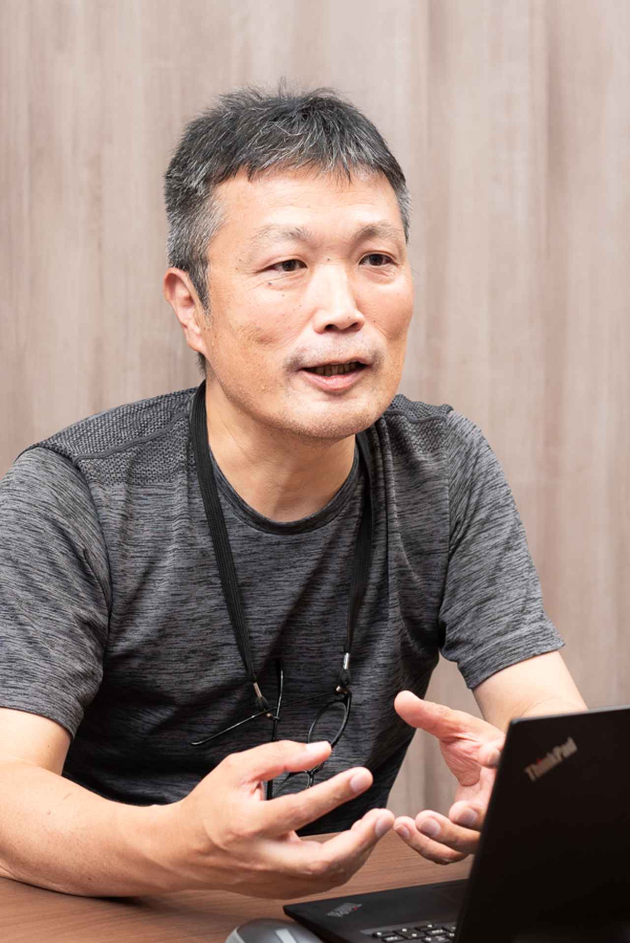 画像: 佐藤康文氏（日立製作所 生成AIアプリケーション＆共通基盤室 PJ推進部 部長）