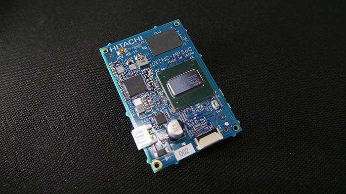 画像: Photograph of an edge controller: A 40 by 60 mm circuit board equipped with a hybrid FPGA-CPU chip and various interfaces (USB 3.0, etc.)